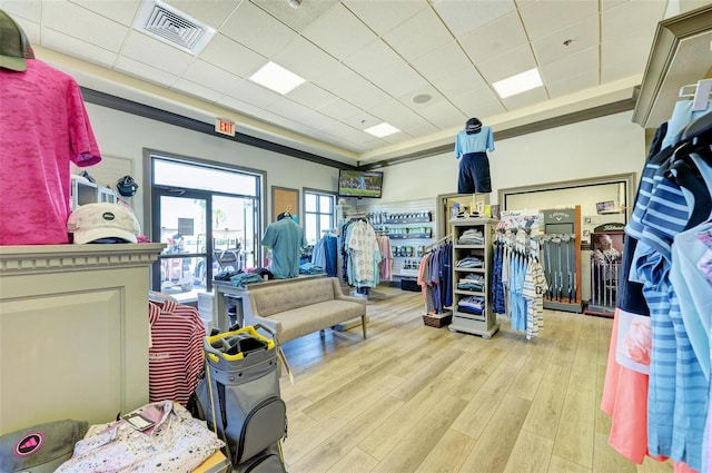 interior space featuring light hardwood / wood-style floors and a drop ceiling