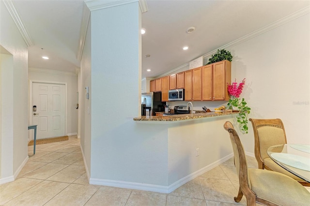 kitchen featuring crown molding, light tile patterned floors, kitchen peninsula, stainless steel appliances, and light stone countertops