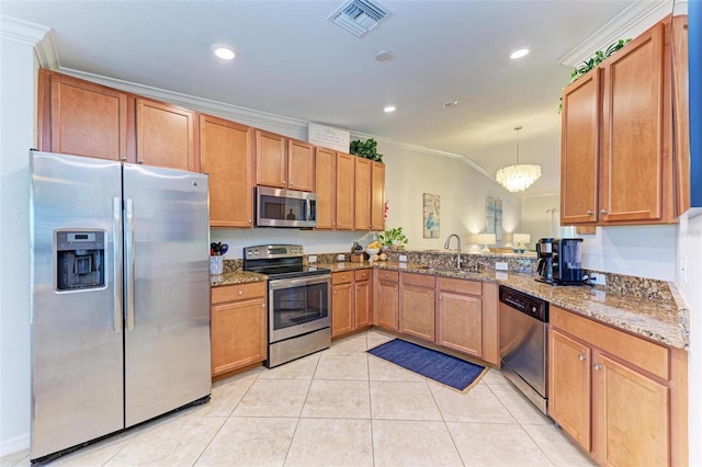 kitchen with appliances with stainless steel finishes, pendant lighting, sink, ornamental molding, and light stone counters