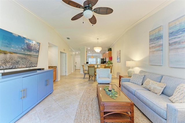 living room featuring crown molding, vaulted ceiling, light tile patterned floors, and ceiling fan