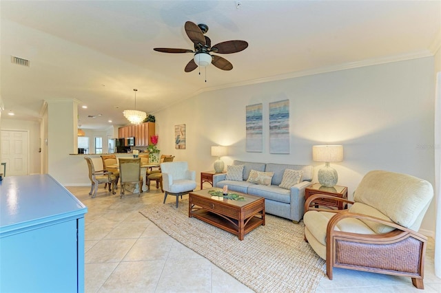 tiled living room featuring crown molding and ceiling fan