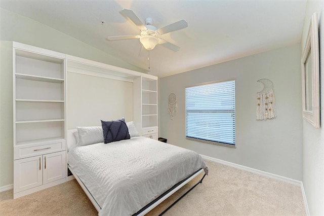 bedroom featuring ceiling fan, lofted ceiling, and light carpet