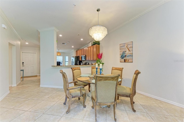 tiled dining space with crown molding and an inviting chandelier