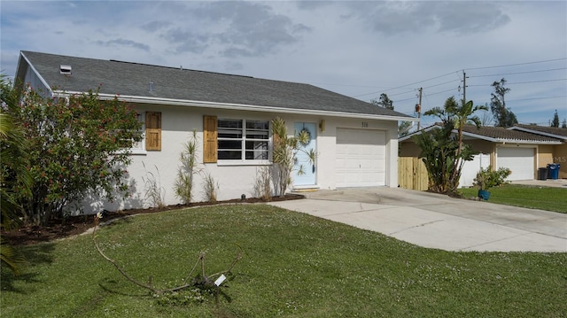 ranch-style house with a garage and a front lawn