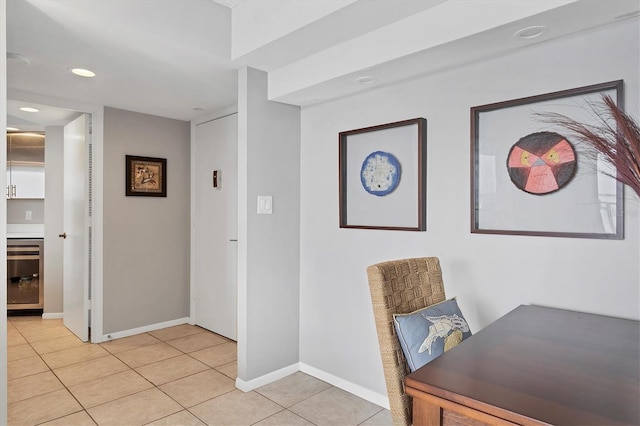 office space featuring light tile patterned floors and beverage cooler