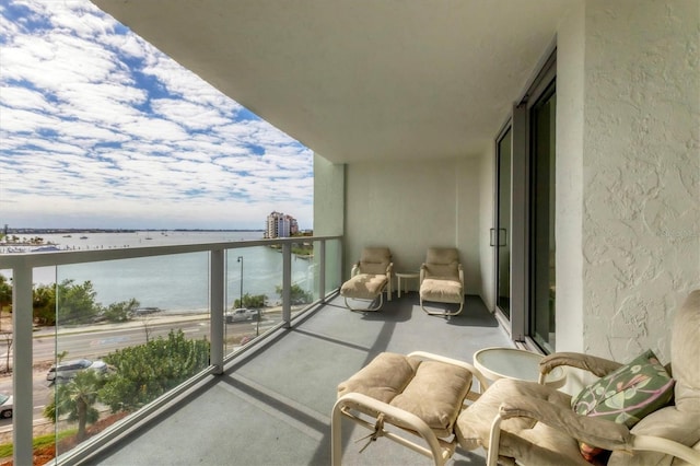 balcony featuring a water view