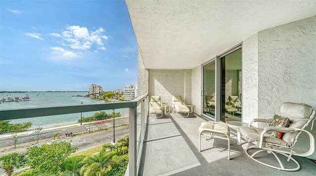 balcony featuring a water view