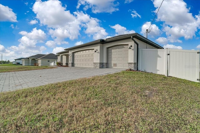 exterior space featuring a lawn and a garage