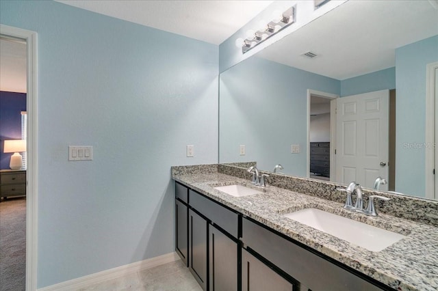 bathroom with vanity and tile patterned floors