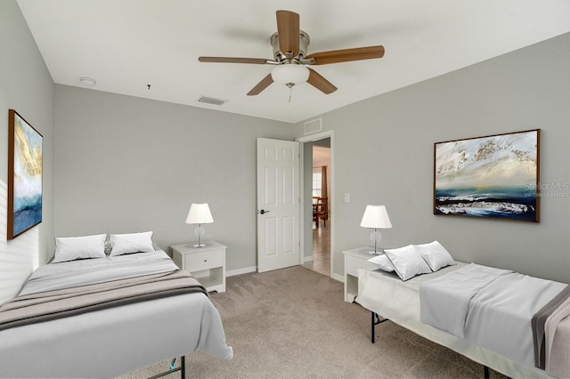 bedroom with light carpet and ceiling fan