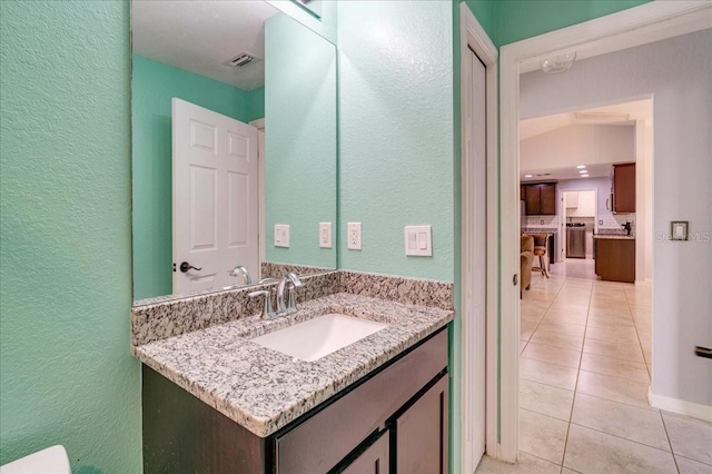 bathroom featuring tile patterned floors and vanity