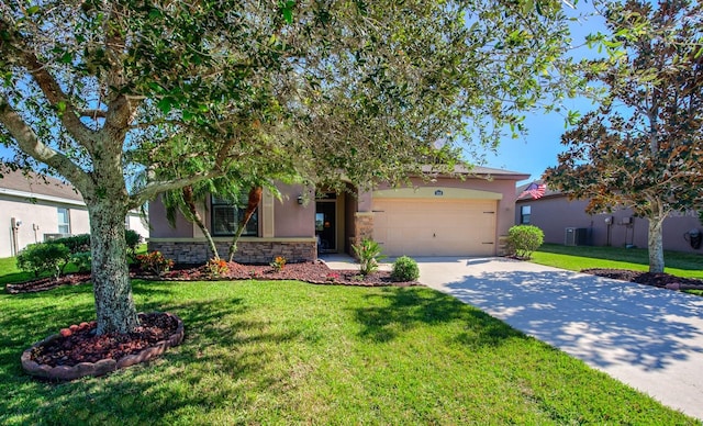 view of front of property featuring a front lawn, central air condition unit, and a garage