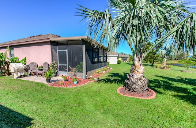 view of yard with a patio area and a sunroom