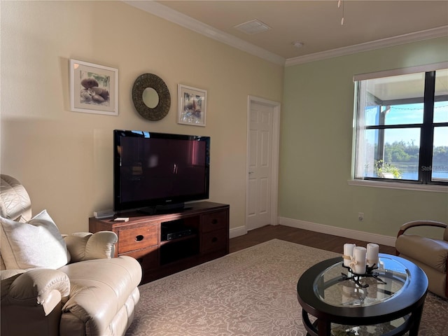 living room featuring crown molding and hardwood / wood-style floors