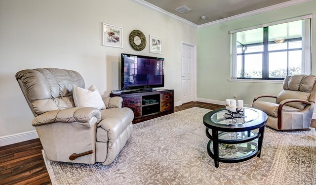 living room with ornamental molding and hardwood / wood-style flooring