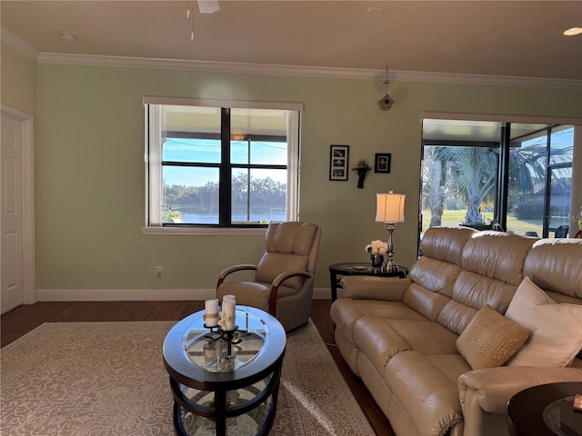 living room with ceiling fan, ornamental molding, and wood-type flooring