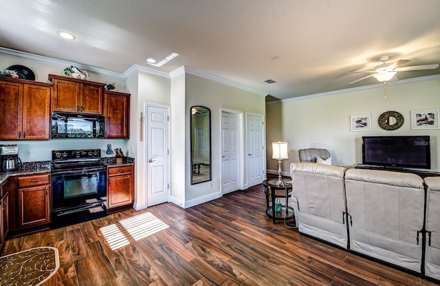 kitchen featuring dark hardwood / wood-style floors, black appliances, and ornamental molding