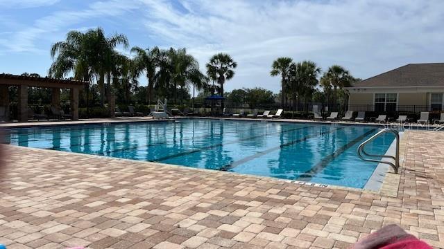 pool featuring a patio area