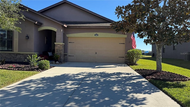 single story home with a front lawn and a garage