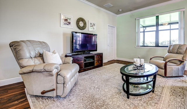 living area featuring baseboards, wood finished floors, and crown molding