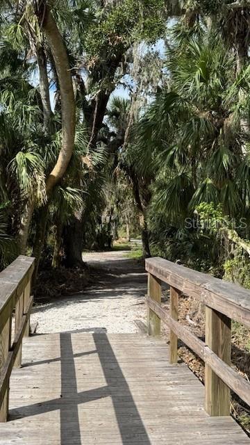 surrounding community with a wooden deck