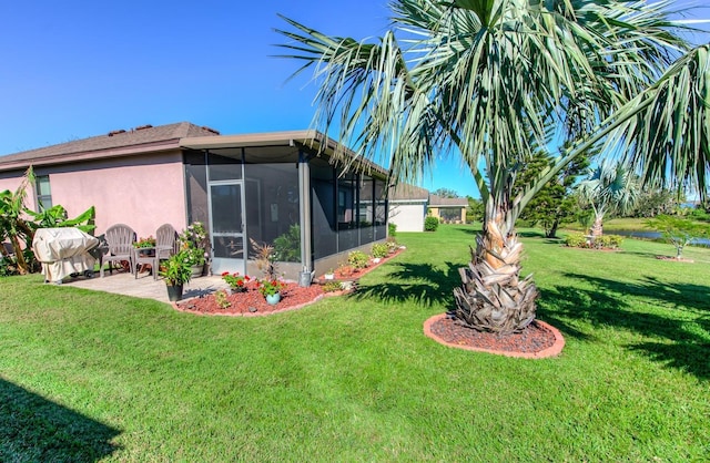 view of yard with a patio and a sunroom