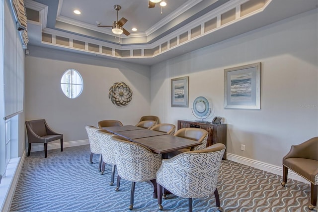 carpeted dining area featuring ceiling fan and crown molding