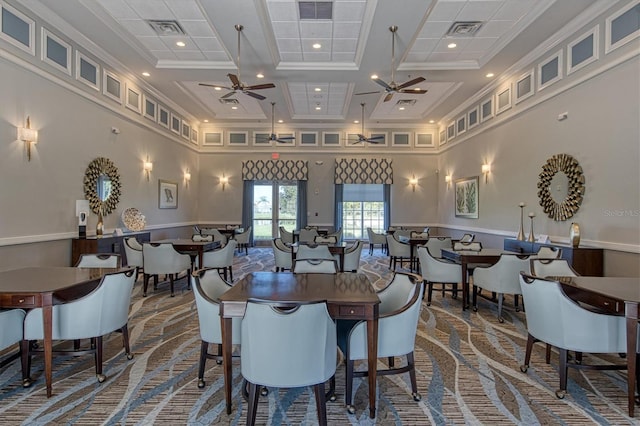 dining space featuring beam ceiling, ceiling fan, a high ceiling, coffered ceiling, and crown molding