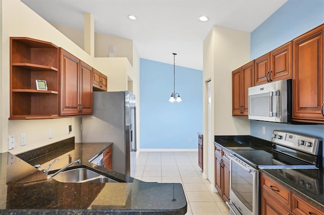 kitchen featuring sink, hanging light fixtures, stainless steel appliances, an inviting chandelier, and light tile patterned floors