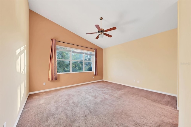 spare room with ceiling fan, carpet, and lofted ceiling