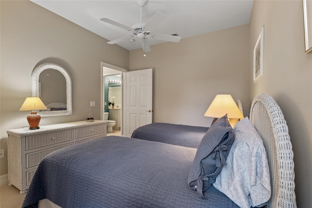 bedroom featuring ceiling fan and connected bathroom