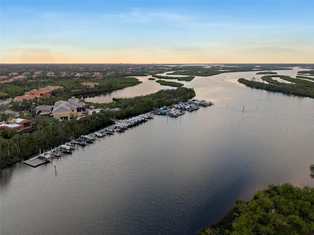 aerial view at dusk with a water view