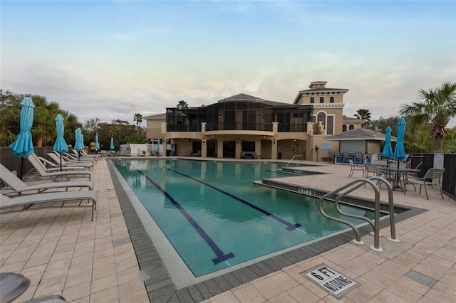 view of pool featuring a patio