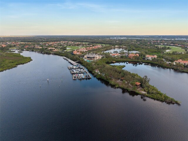 aerial view at dusk with a water view