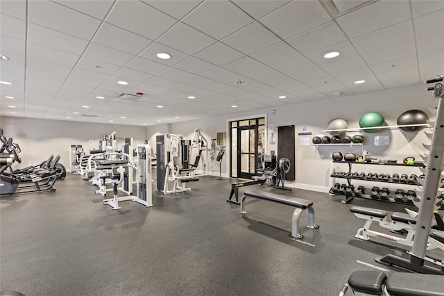 workout area featuring a paneled ceiling