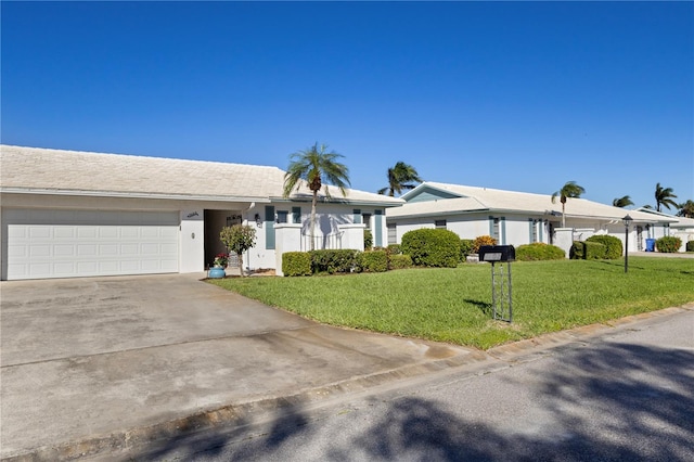 single story home featuring a front yard and a garage