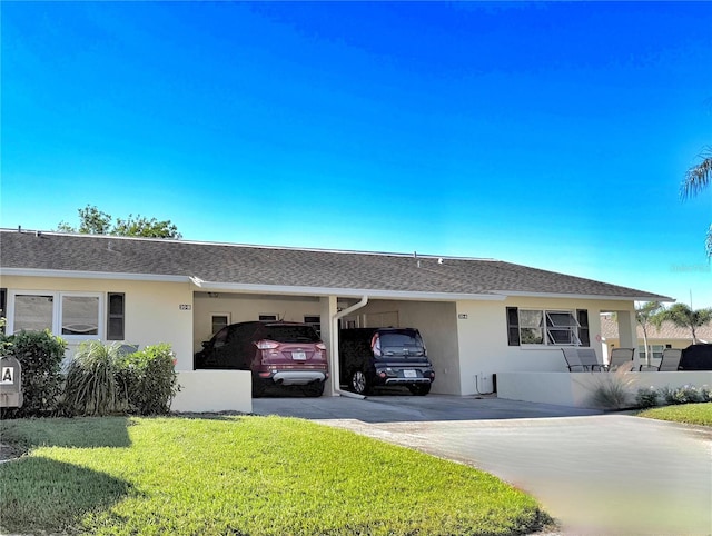 single story home featuring a front yard and a carport