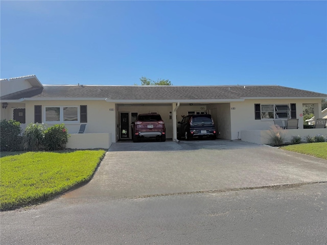 ranch-style house with a front lawn and a carport