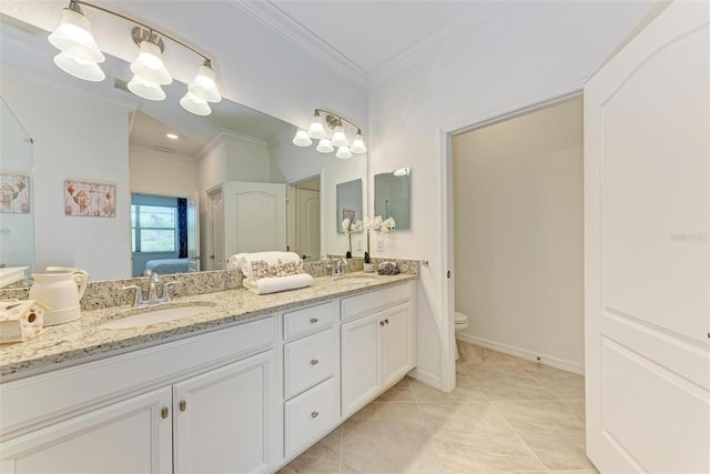 bathroom featuring tile patterned floors, vanity, toilet, and crown molding