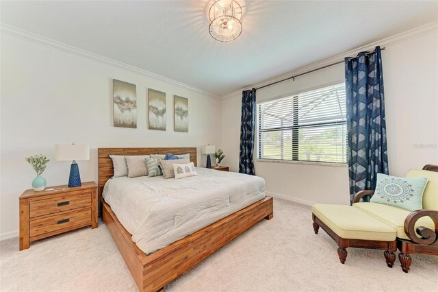 bedroom with carpet floors and crown molding