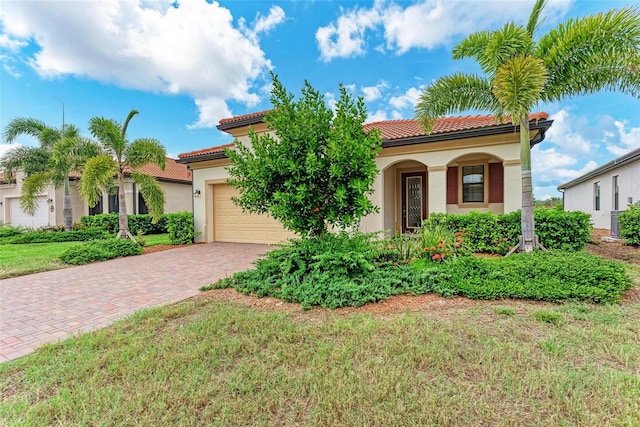 mediterranean / spanish-style house with a front lawn