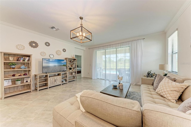 tiled living room with a chandelier, plenty of natural light, and ornamental molding