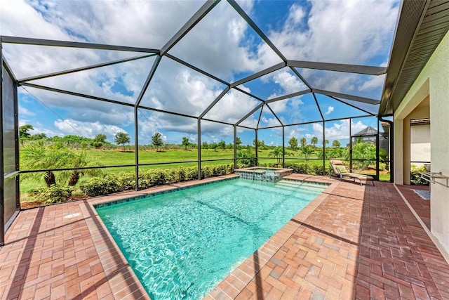 view of pool featuring a patio area, a lanai, and an in ground hot tub