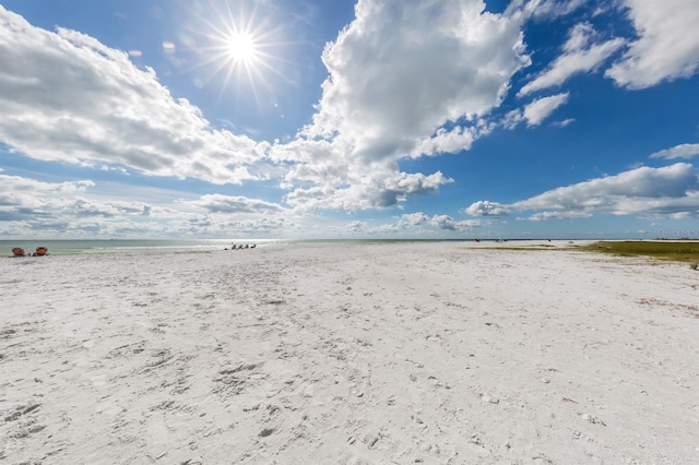 property view of water featuring a beach view