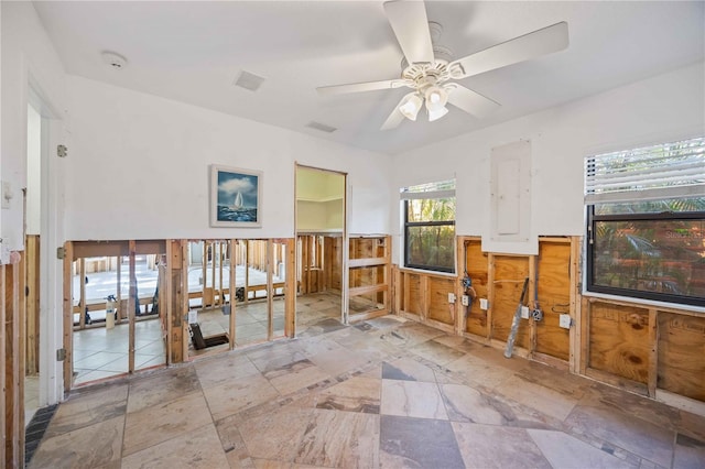 interior space featuring ceiling fan