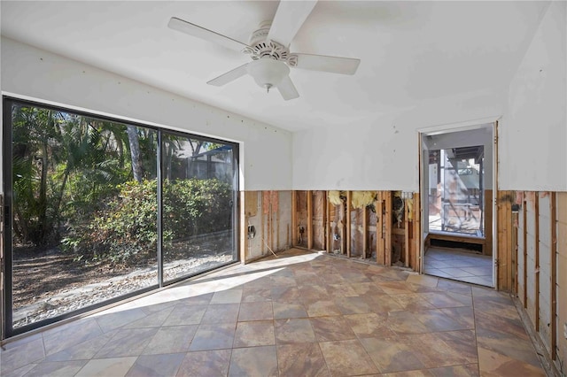 empty room with plenty of natural light and ceiling fan