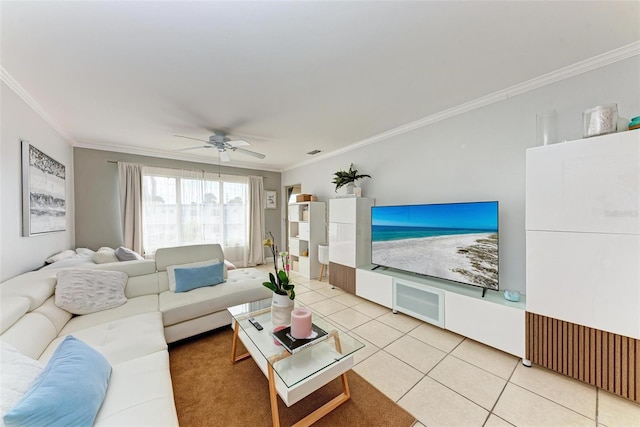 tiled living room with ceiling fan and crown molding