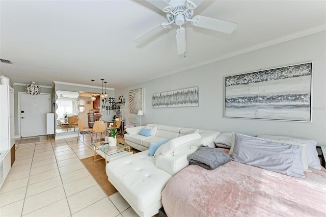 bedroom with ceiling fan, crown molding, and light tile patterned flooring