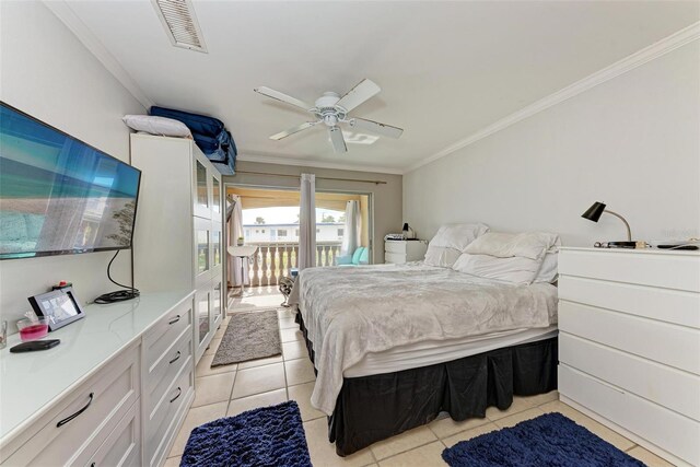 tiled bedroom with ceiling fan and crown molding