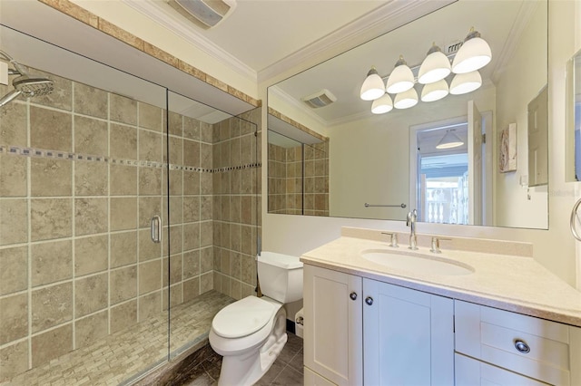 bathroom with crown molding, a shower with door, vanity, and toilet